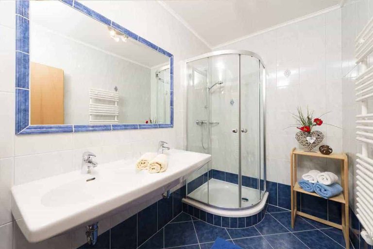 Modern Bathroom with Large Shower, Double Vanity, and Towels at Pension Niederreiter